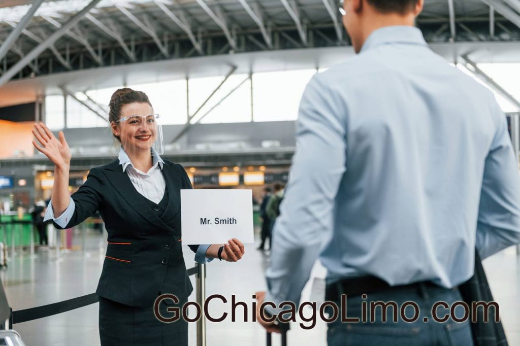 Meet by the woman with text. Young businessman in formal clothes is in the airport at daytime - Go Chicago Limo Meet by the woman with text. Young businessman in formal clothes is in the airport at daytime