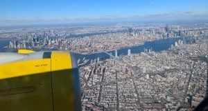 Spirit Airlines plane above New York - Go Chicago Limo Spirit Airlines plane above New York
